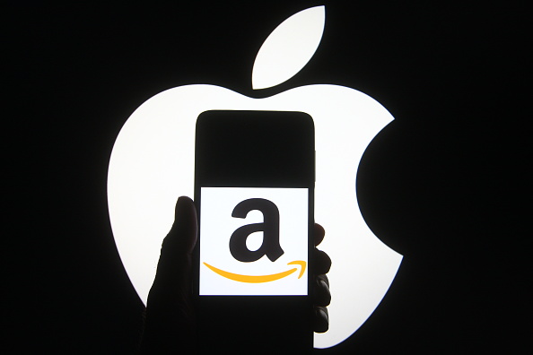 Amazon logo on an iPhone, held in silhouette of Apple logo
