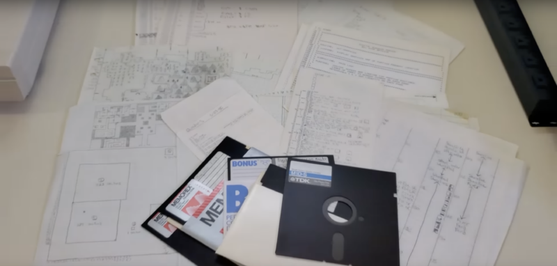 The disks and diagrams Mike Brixius has to work with in finishing his 1984 CRPG project.